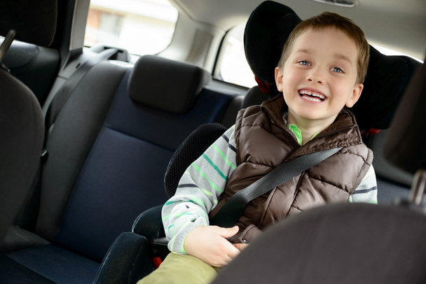 Happy little boy in car safety seat.  - Foto, imagen