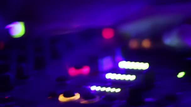 Deejay's hands pushing and turning buttons on the mixing console. Nightclub - Filmmaterial, Video