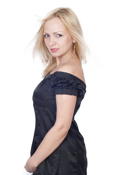 Beautiful young woman in black dress over white - Zdjęcie, obraz