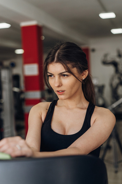 Portrait of a beautiful girl in the gym - Foto, Imagem