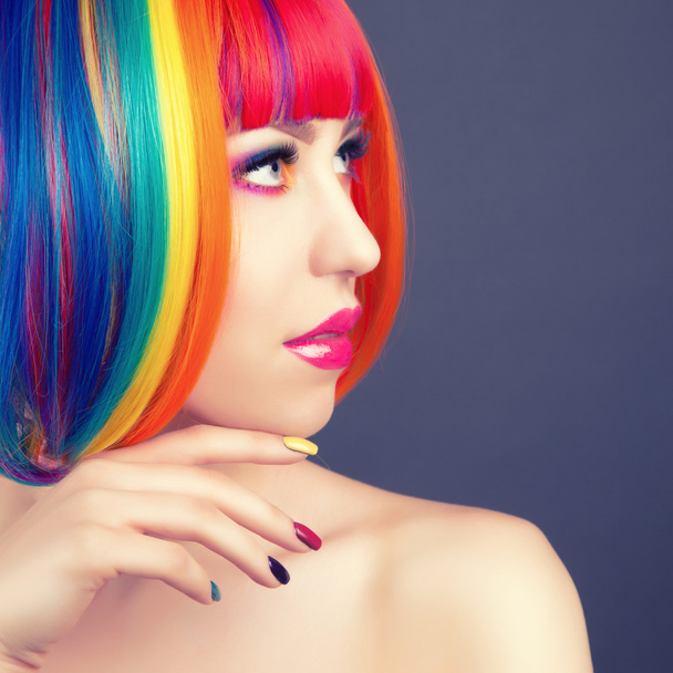 beautiful woman wearing colorful wig and showing colorful nails  - Fotoğraf, Görsel