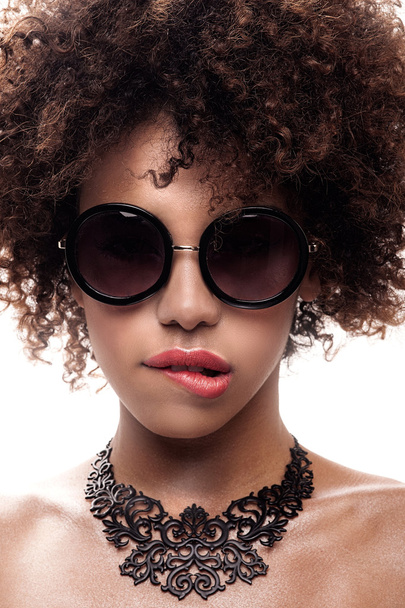 Young girl with afro posing. - 写真・画像