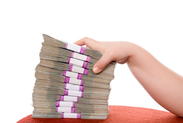 Hand and pile of money - Foto, imagen