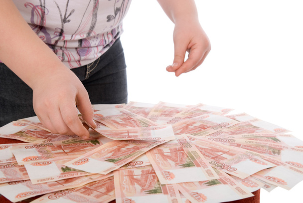 The teenager gathers money in a hand - Φωτογραφία, εικόνα