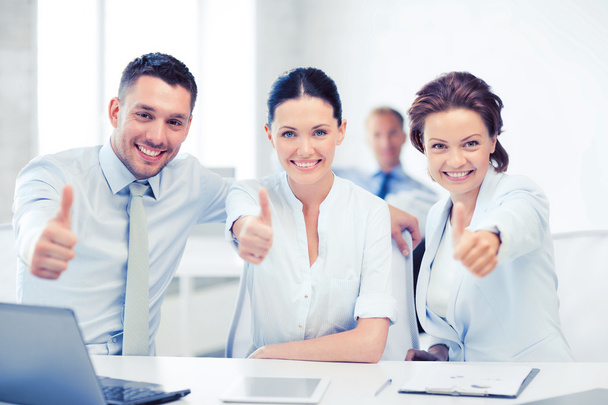 business team showing thumbs up in office - 写真・画像