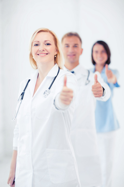 team of doctors showing thumbs up - Photo, Image