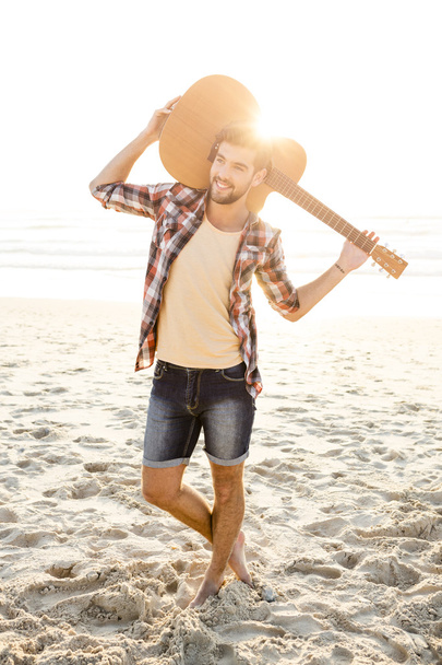 Handsome young man at the beach - Foto, Imagen
