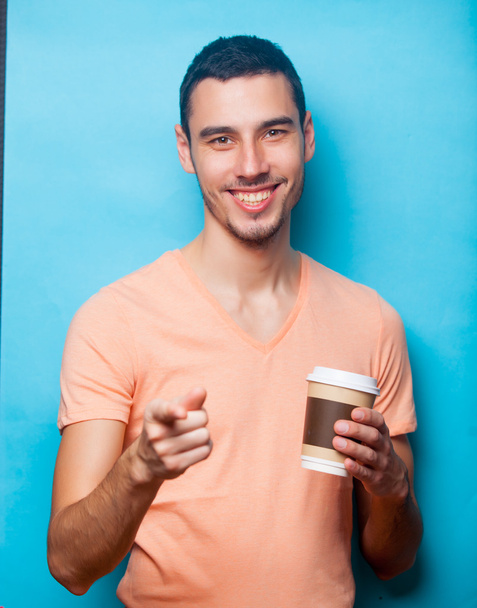 young man with cup of coffee - Фото, зображення
