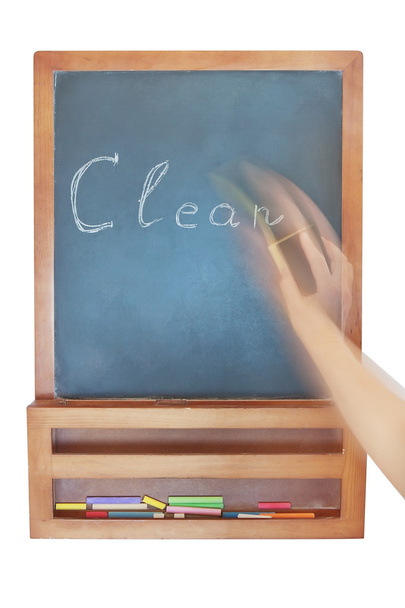 Wiping-Cleaning the inscription on the chalkboard. - Photo, Image