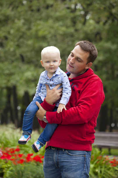 Father with two year old son in summer park - Foto, imagen