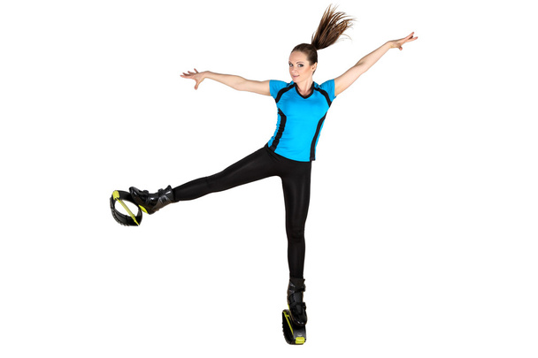Sports girl in shoes for kangoo jumping - Zdjęcie, obraz