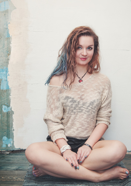 Young beautiful woman sitting on the floor  - Photo, image
