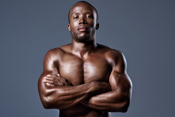serious portrait of confident buffed black african man with toned muscular body - Фото, зображення