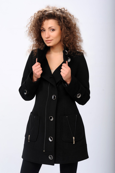Girl in a black coat - Foto, Imagen