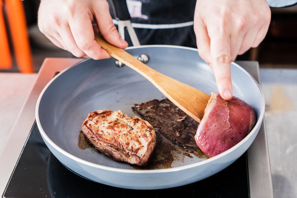 kitchen spatula turning steaks - Photo, image