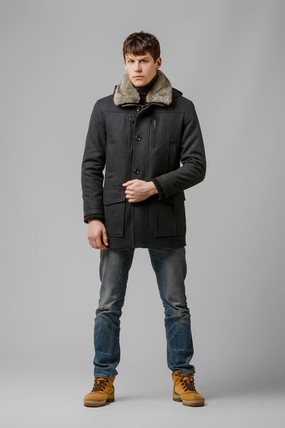 handsome man in a coat - Фото, изображение