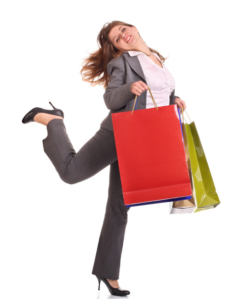 Laughing business woman with gift bag. - Фото, изображение