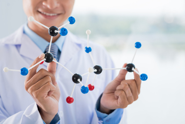 Scientist showing molecular structure - Фото, зображення