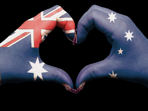 Coração e gesto de amor por mãos coloridas na bandeira austrália para t
 - Foto, Imagem