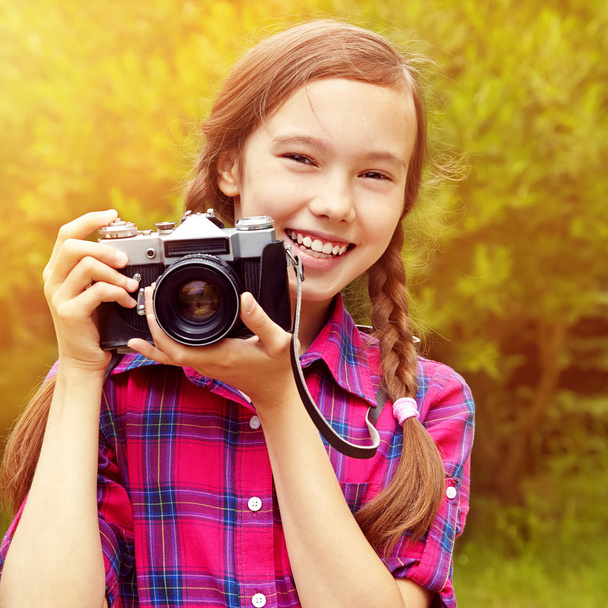 teenage girl with a camera - Valokuva, kuva