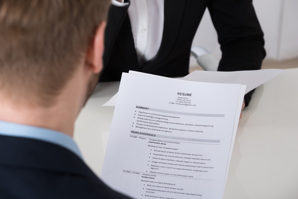 Businessman Analyzing Resume - Foto, Imagen