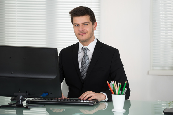 Young Businessman Working In Office - Foto, Imagem