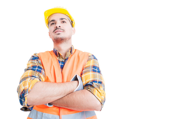 Attractive smiling engineer standing with arms crossed and act c - Photo, Image