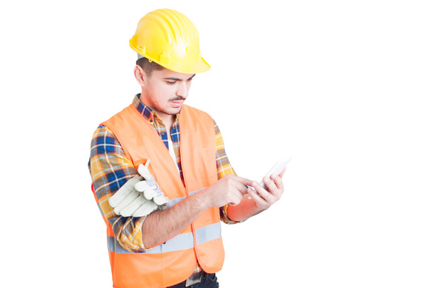 Business modern work concept with young engineer and smartphone - Photo, Image