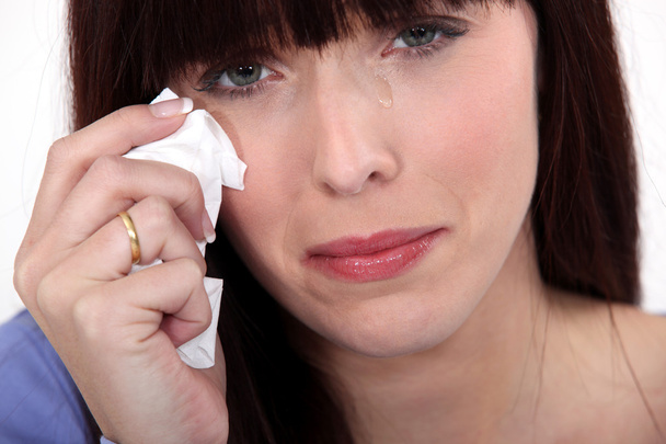 Woman crying with a tissue - Fotó, kép