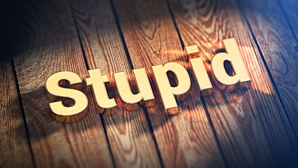 Word Stupid on wood planks - Foto, Imagem