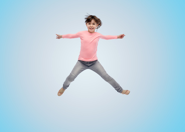 feliz niña saltando en el aire
 - Foto, Imagen