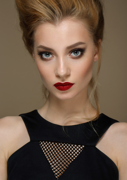 Close-up portrait of beautiful model with bright lips. Shooted on biege background - Foto, imagen