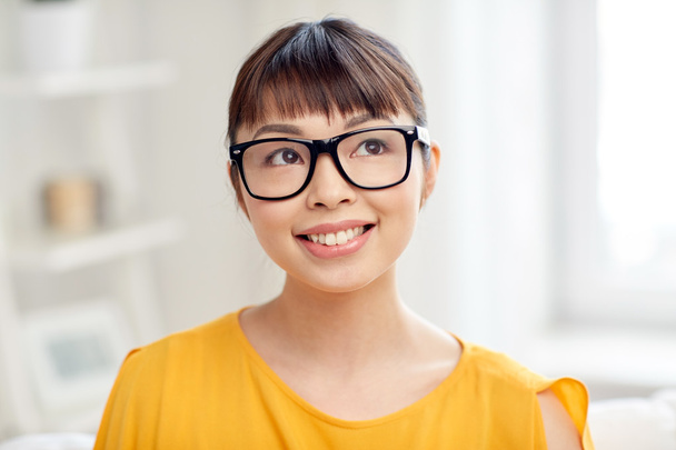 happy asian young woman in glasses at home - Фото, изображение