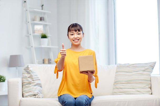 happy asian young woman with parcel box at home - Fotografie, Obrázek