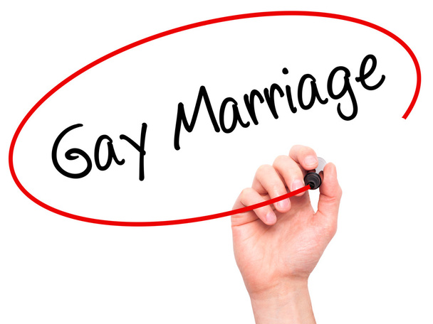 Człowiek w zapasie pismo małżeństwa homoseksualne z czarnego markera na wizualne ekranie - Zdjęcie, obraz