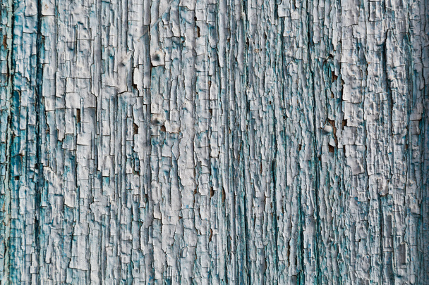 Antigua pintura agrietada azul sobre fondo de madera
 - Foto, imagen