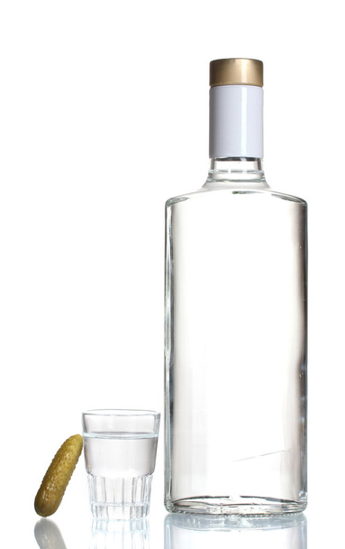 Bottle of vodka and wineglass with cucumber isolated on white - Valokuva, kuva