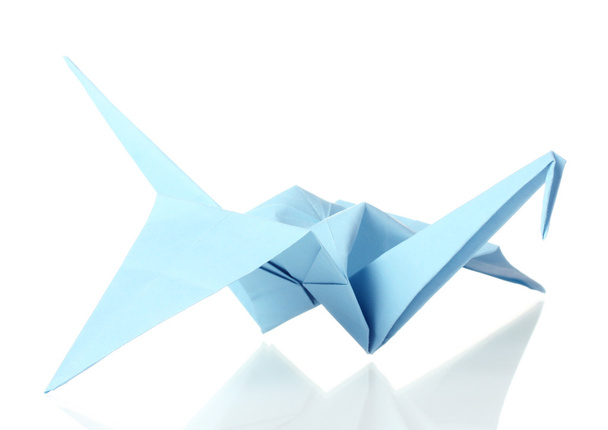 Origami crane out of the blue paper isolated on white - 写真・画像
