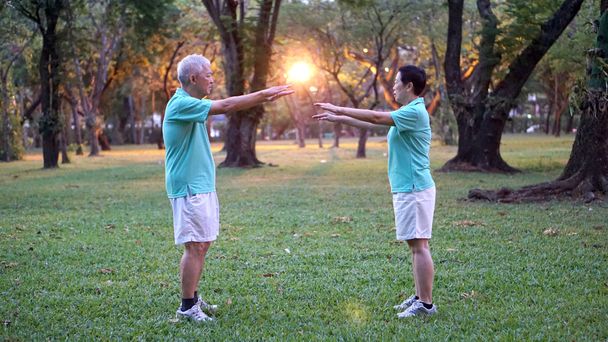 senior couple exercise in the urban park at early morning - Photo, Image