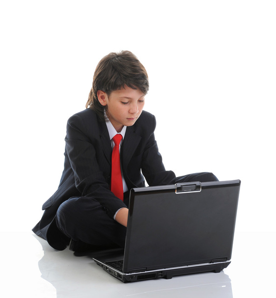 Boy in business suit sitting in front of computer - Zdjęcie, obraz