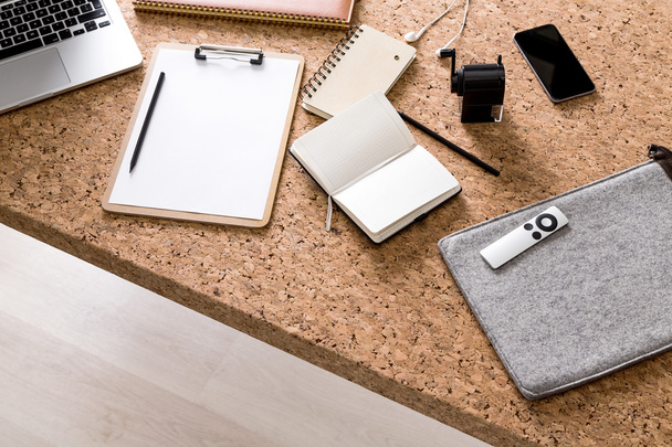 Cork office table, notebooks, laptop, smartphone and sharpener on it. Concept of work. - Fotografie, Obrázek