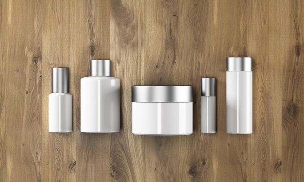 Row of cream boxes of different shapes. Wooden background. Concept of cosmetics. - 写真・画像