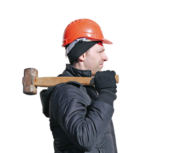 Worker with big sledge hammer on the shoulder isolated - Photo, Image