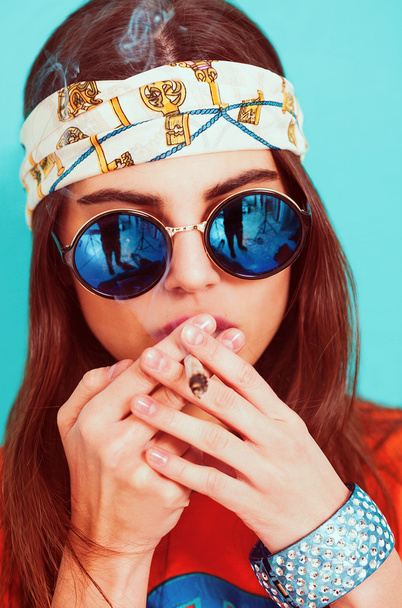 Hippie girl smoking weed and wearing sunglasses - Fotoğraf, Görsel
