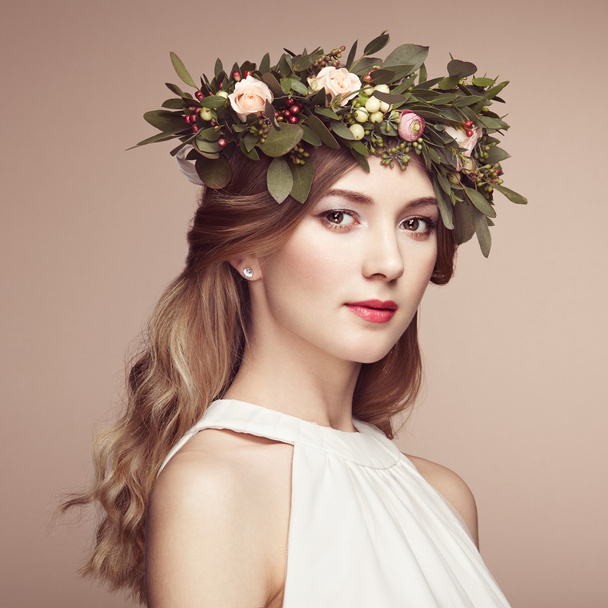 Beautiful blonde woman with flower wreath   - Photo, image