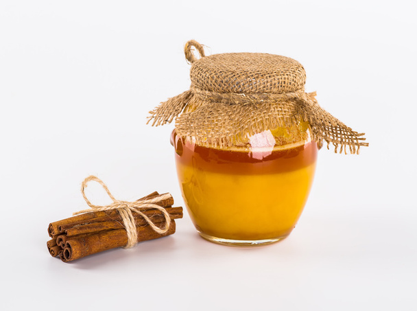 Fresh honey with nuts, lemons, still life, white background - Photo, Image