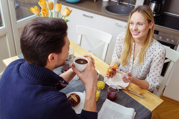 Happy young couple having a continental breakfast - Valokuva, kuva