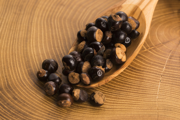 guarana seeds on wooden spoon - Photo, Image