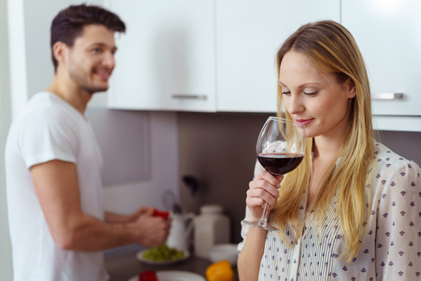 Young woman enjoying a glass of red wine - Photo, Image