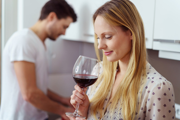 Pretty young blond woman drinking red wine - Photo, image